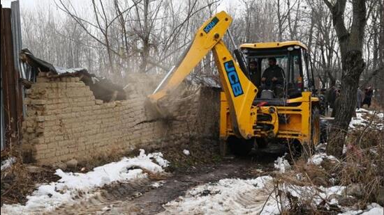 Demolition drive in progress in Shopian on Saturday. (Twitter)