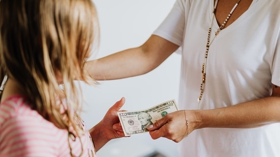 Use real-life examples: Children are more likely to understand and retain information when it's presented in a relatable way. Use real-life examples to teach your child about money management. For example, if you're teaching your child about budgeting, you can use your grocery list and show them how you compare prices and make a decision on which products to buy.(Pexels)