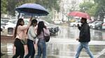 New Delhi , India - Jan. 29, 2023: People seen with umbrella's during light rain drizzles at Connaught Place, in New Delhi , India, on Sunday. (Hindustan Times) New Delhi , India - Jan. 29, 2023: People seen with umbrella's during light rain drizzles at Connaught Place, in New Delhi , India, on Sunday. (Hindustan Times)