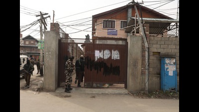 An NIA team sealing the Hurriyat Conference office in Rajbagh area of Srinagar on Sunday. (Waseem Andrabi/HT) An NIA team sealing the Hurriyat Conference office in Rajbagh area of Srinagar on Sunday. (Waseem Andrabi/HT)