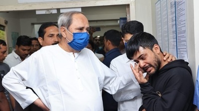 Odisha Chief Minister Naveen Patnaik consoles the minister's distressed son at the hospital. (ANI) Odisha Chief Minister Naveen Patnaik consoles the minister's distressed son at the hospital. (ANI)