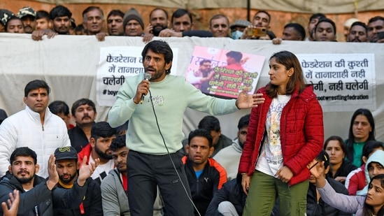 New Delhi, Jan 20 (ANI): Wrestler Bajrang Punia and Vinesh Phogat speak during a silent protest against the Wrestling Federation of India (WFI) and its chief Brij Bhushan Sharan Singh against whom sexual harassment allegations were made, at Jantar Mantar, in New Delhi on Friday. (ANI Photo/ Ishant) (Ishant )