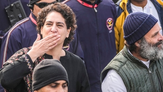 Rahul Gandhi, right and his sister and party leader Priyanka Vadra, center left, gesture toward the crowd as they walk with their supporters during a 5-month-long "Unite India March," in Srinagar, (AP)