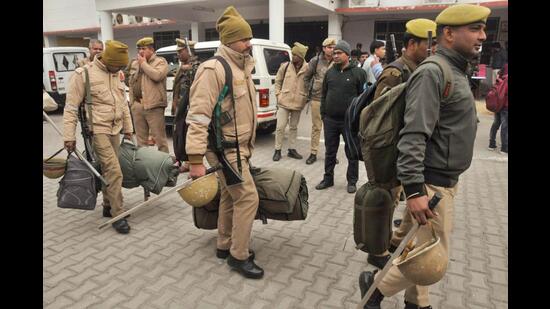 Police personnel leave for the respective polling stations on the eve of the MLC (Vidhan Parishad) election of the first block teacher and graduate quota, in Moradabad, on Sunday. (PTI)