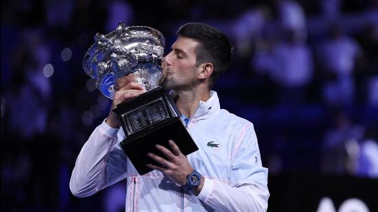Serbia's Novak Djokovic celebrates with the trophy after winning his final match against Greece's Stefanos Tsitsipas. (REUTERS)