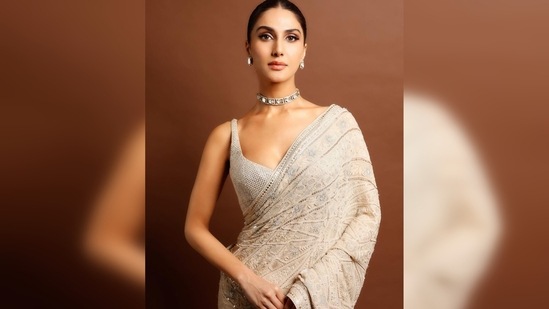 In another set of latest Instagram photos, Vaani Kapoor flaunts her desi side in an ivory saree and a sleeveless sequins blouse.(Instagram/@_vaanikapoor_)