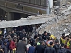 Security officials and rescue workers search bodies at the site of suicide bombing, in Peshawar. Security officials and rescue workers search bodies at the site of suicide bombing, in Peshawar.