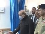 Pakistan prime minister Shehbaz Sharif enquires about the condition of a victim of Peshawar blast at the Lady Reading Hospital.