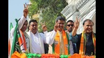 Tripura chief minister Manik Saha with Assam chief minister Himanta Biswa Sarma and BJP national spokesperson Sambit Patra show a victory sign during the roadshow in Agartala on Monday. (ANI) Tripura chief minister Manik Saha with Assam chief minister Himanta Biswa Sarma and BJP national spokesperson Sambit Patra show a victory sign during the roadshow in Agartala on Monday. (ANI)