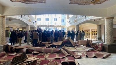 Security officials and rescue workers gather at the site of suicide bombing inside a mosque, in Peshawar, Pakistan, Monday, Jan. 30, 2023. A suicide bomber struck Monday inside a mosque in the northwestern Pakistani city of Peshawar, killing multiple people and wounding scores of worshippers, officials said. AP/PTI(AP01_30_2023_000339B) (AP) Security officials and rescue workers gather at the site of suicide bombing inside a mosque, in Peshawar, Pakistan, Monday, Jan. 30, 2023. A suicide bomber struck Monday inside a mosque in the northwestern Pakistani city of Peshawar, killing multiple people and wounding scores of worshippers, officials said. AP/PTI(AP01_30_2023_000339B) (AP)