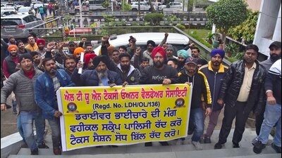 LTUN Taxi owners’ welfare society holding a protest at DC office regarding Punjab government's new vehicle scrapping policy in Ludhiana on Monday. (Gurpreet Singh/HT)
