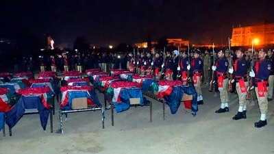 In this handout photo released by Pakistan's Police Department, a police contingent present guard of honour during a funeral of police officers, who were killed in the suicide bombing inside a mosque, in Peshawar, Pakistan. (AP) In this handout photo released by Pakistan's Police Department, a police contingent present guard of honour during a funeral of police officers, who were killed in the suicide bombing inside a mosque, in Peshawar, Pakistan. (AP)