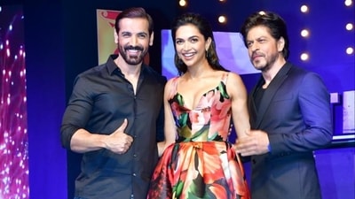 John Abraham, Deepika Padukone, and Shah Rukh Khan at the success event of Pathaan in Mumbai on Monday John Abraham, Deepika Padukone, and Shah Rukh Khan at the success event of Pathaan in Mumbai on Monday