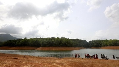 Visitors watch as elephants are bathed at the Elephant Rehabilitation Centre, Kappukadu, in Thiruvananthapuram in Kerala (HT File Photo/Vivek Nair)