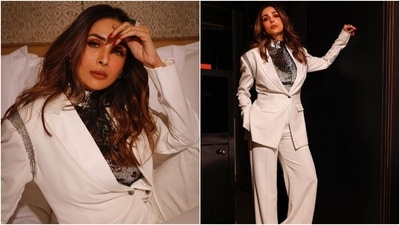 Earlier, Malaika had posted pictures from a new photoshoot for which she donned a white suit styled with a silver sequinned turtleneck top. While the blazer features notch lapel collars, front button closure, patch pockets, full sleeves, silver embellishments, tailored fitting and padded shoulders, the high-waisted pants have a flared silhouette. (Instagram) Earlier, Malaika had posted pictures from a new photoshoot for which she donned a white suit styled with a silver sequinned turtleneck top. While the blazer features notch lapel collars, front button closure, patch pockets, full sleeves, silver embellishments, tailored fitting and padded shoulders, the high-waisted pants have a flared silhouette. (Instagram)