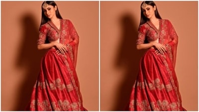 Mouni teamed it with a long flowy red silk skirt with golden embroidery details throughout, and added a red organza dupatta with golden zari details at the border. (Instagram/@imouniroy) Mouni teamed it with a long flowy red silk skirt with golden embroidery details throughout, and added a red organza dupatta with golden zari details at the border. (Instagram/@imouniroy)