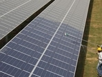 Workers clean photovoltaic panels inside a solar power plant in Gujarat, India. US senator Bob Menendez has introduced a legislation for cooperation between the United States and India related to clean climate technologies and energy transmission. (REUTERS) Workers clean photovoltaic panels inside a solar power plant in Gujarat, India. US senator Bob Menendez has introduced a legislation for cooperation between the United States and India related to clean climate technologies and energy transmission. (REUTERS)