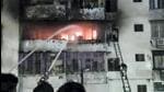 Firefighters try to douse the fire at Aashirwad Towers in Dhanbad. (PTI) Firefighters try to douse the fire at Aashirwad Towers in Dhanbad. (PTI)