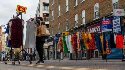 UK Economy: A customer looks at a clothing stall at Petticoat Lane Market in London, UK. (Bloomberg) UK Economy: A customer looks at a clothing stall at Petticoat Lane Market in London, UK. (Bloomberg)