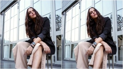 In classic black stilettos, Neha added silver hoop earrings and wore her tresses open in messy curls as she posed for the pictures.&nbsp; (Instagram/@nehadhupia)