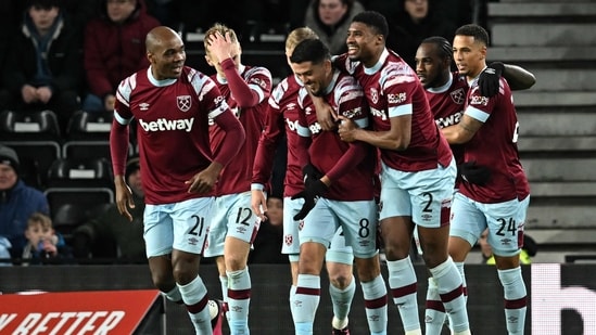 West Ham United's English midfielder Michail Antonio (2R) celebrates scoring the team's second goal during the English FA Cup fourth round football match vs Derby County(AFP)