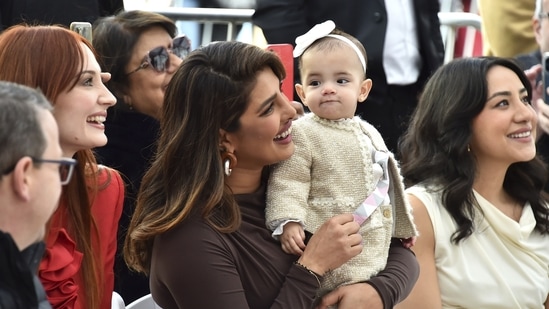 Priyanka Chopra with girl  Malti Marie Chopra Jonas astatine  the Jonas Brothers' Hollywood Walk of Fame prima  installation ceremony.(Jordan Strauss/Invision/AP)