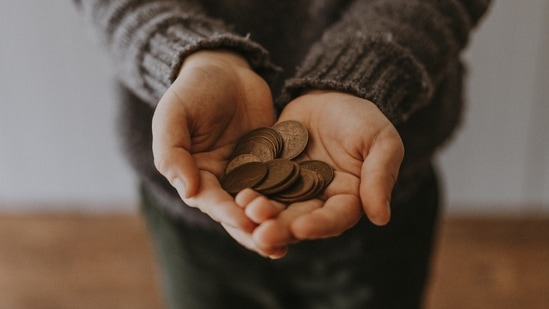 Allowance system: Allowance is a great way to teach children about money management. Giving your child an allowance and letting them make their own decisions about how to spend or save it can help them learn about budgeting, saving, and the value of money.(Unsplash)