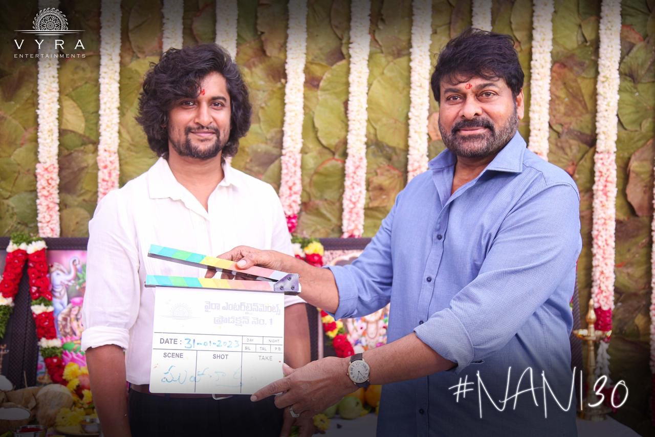 Nani and Chiranjeevi with the clapperboard.