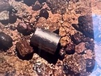 A radioactive capsule, which had fallen off a truck, after it was found along a desert highway south of Newman, Western Australia.(AFP) A radioactive capsule, which had fallen off a truck, after it was found along a desert highway south of Newman, Western Australia.(AFP)