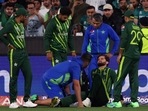 Shaheen Afridi is attended by physio after falling while catching out Harry Brook during the T20 World Cup final(AP) Shaheen Afridi is attended by physio after falling while catching out Harry Brook during the T20 World Cup final(AP)