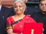 New Delhi: Union Finance Minister Nirmala carrying a folder-case poses for photographs outside the Finance Ministry at North Block, in New Delhi, Wednesday, Feb. 1, 2023, ahead of the presentation of the Union Budget 2023-24. (PTI Photo/Manvender Vashist Lav) New Delhi: Union Finance Minister Nirmala carrying a folder-case poses for photographs outside the Finance Ministry at North Block, in New Delhi, Wednesday, Feb. 1, 2023, ahead of the presentation of the Union Budget 2023-24. (PTI Photo/Manvender Vashist Lav)