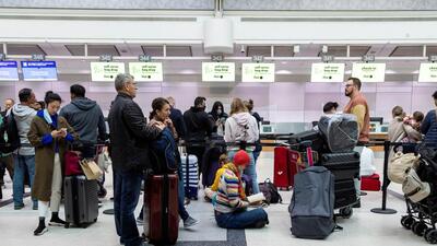 A traveller reads a book while waiting to check into a flight at Toronto Pearson International Airport in Mississauga, Ontario, Canada. (REUTERS) A traveller reads a book while waiting to check into a flight at Toronto Pearson International Airport in Mississauga, Ontario, Canada. (REUTERS)