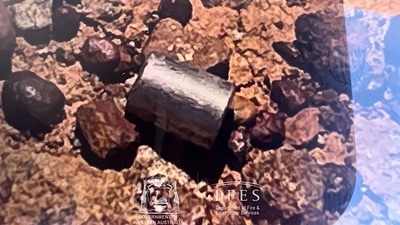 A radioactive capsule, which had fallen off a truck, after it was found along a desert highway south of Newman, Western Australia. (AFP) A radioactive capsule, which had fallen off a truck, after it was found along a desert highway south of Newman, Western Australia. (AFP)
