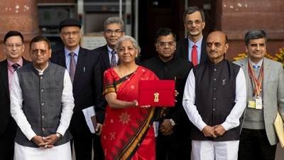 India's Finance Minister Nirmala Sitharaman holds up a folder with the Government of India's logo as she leaves her office to present the federal budget in the parliament, in New Delhi, India, February 1, 2023. REUTERS/Adnan Abidi (REUTERS)
