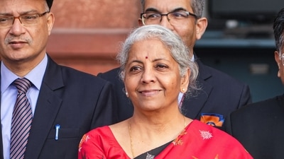 New Delhi: Union Finance Minister Nirmala carrying a folder-case poses for photographs outside the Finance Ministry at North Block, in New Delhi, Wednesday, Feb. 1, 2023, ahead of the presentation of the Union Budget 2023-24. (PTI Photo/Manvender Vashist Lav)