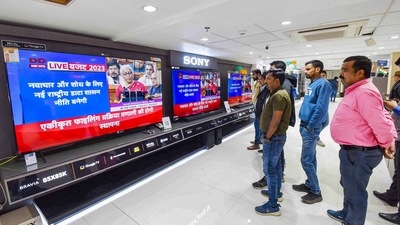 Budget 2023: People watch Finance Minister Nirmala Sitharaman presenting the Union Budget 2023-24 in Parliament, at an electronics store in Patna, Wednesday. (PTI) Budget 2023: People watch Finance Minister Nirmala Sitharaman presenting the Union Budget 2023-24 in Parliament, at an electronics store in Patna, Wednesday. (PTI)
