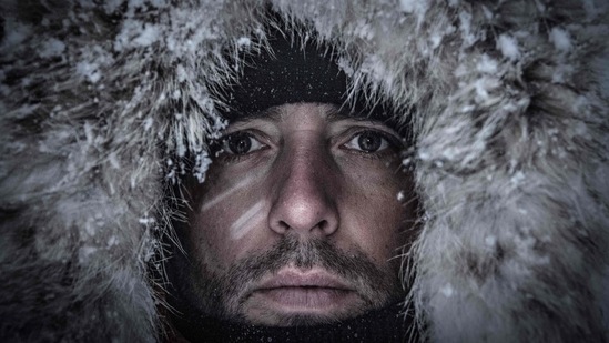 Arthur Guerin-Boeri poses on the Spildra Island northern Arctic Circle. The Frenchman is a holder of multiple world records in freediving under ice, but he hopes to push the perception of freediving beyond sport and performance.(Olivier Morin / AFP)