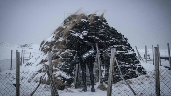 Dressed for his dive with killer whales, Arthur Guerin-Boeri poses in the Spildra Island northern Arctic Circle, on January 26. According to AFP, the Arctic Atlantic ocean is at 3 degrees Celsius, while the the air temperature is at minus 4 degrees Celsius at this time of the year, during the polar nights. (Olivier Morin / AFP)