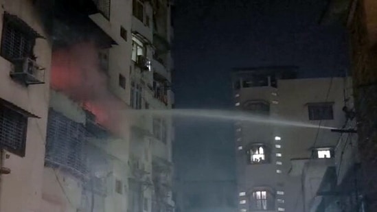 Firefighters douse a fire that broke out at Ashirwad Tower of Joraphatak area in Dhanbad.(ANI)