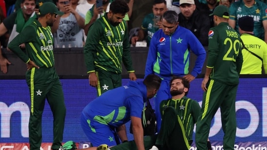 Shaheen Afridi is attended by physio after falling while catching out Harry Brook during the T20 World Cup final