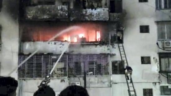 At least 14 people, including women and children, died in a massive fire that broke out in an apartment in Dhanbad on Tuesday evening. Prime Minister Narendra Modi condoled the loss of lives in the devastating fire and announced an ex-gratia of <span class='webrupee'>₹</span>2 lakh for the next-of-kin of the dead. (PTI)