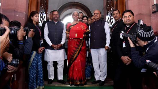 Nirmala Sitharaman, Union minister for finance and corporate affairs along with the ministers of state for finance, Pankaj Chaudhary and Dr. Bhagwat Kishanrao Karad and the senior officials arrived at Parliament ahead of presenting the Union Budget 2023-24 in New Delhi, India, on Tuesday. (Hindustan Times)