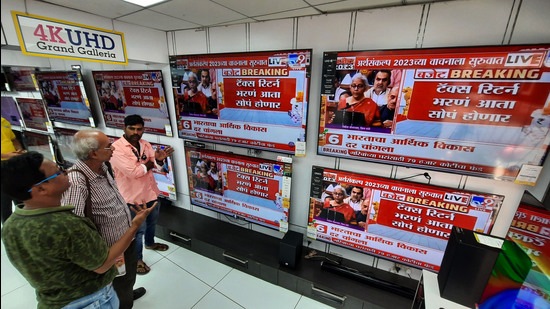 People watch the Union Budget being presented by Finance Minister Nirmala Sitharaman in the Parliament. (HT PHOTO)