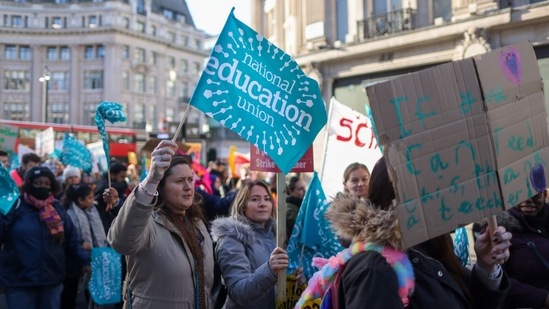 Teachers march during joint strike action by train drivers, teachers, university staff and civil servants, in London, UK, on Wednesday, (Bloomberg)