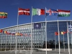 Flags flutter in the wind outside Nato headquarters in Brussels, Belgium. (AP) Flags flutter in the wind outside Nato headquarters in Brussels, Belgium. (AP)