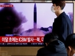 White House On North Korea: A man walks past a TV broadcasting a news report, on North Korea firing a missile.