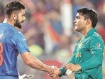 Virat Kohli (L) with Umar Akmal(AP) Virat Kohli (L) with Umar Akmal(AP)