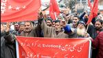 Jammu and Kashmir Kisan Tehreek (JKKT) supporters stage a protest against the administration's land eviction drive across valley, in Srinagar on Thursday. (ANI) Jammu and Kashmir Kisan Tehreek (JKKT) supporters stage a protest against the administration's land eviction drive across valley, in Srinagar on Thursday. (ANI)