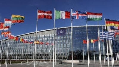 Flags flutter in the wind outside Nato headquarters in Brussels, Belgium. (AP) Flags flutter in the wind outside Nato headquarters in Brussels, Belgium. (AP)