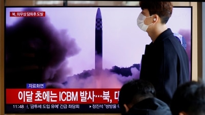 White House On North Korea: A man walks past a TV broadcasting a news report, on North Korea firing a missile. (Reuters)